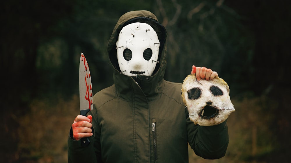 a person wearing a mask and holding a knife