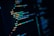Close-up of computer code displayed on a dark monitor, with highlighted syntax in various colors for readability and structure. Lines of code appear in HTML format, demonstrating coding techniques.
