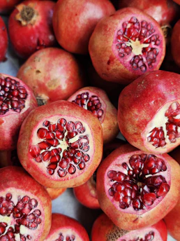 Close-up of vibrant, freshly harvested pomegranates on the farm.