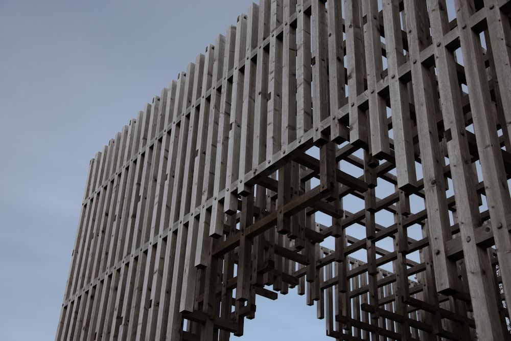 a close up of a wooden structure with a sky in the background