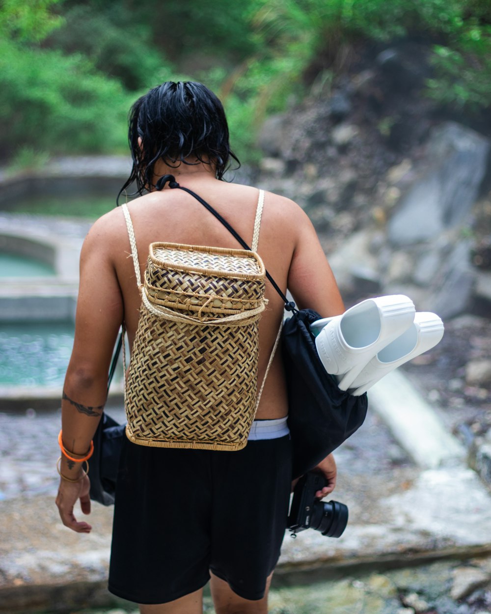 a man with a back pack and a camera