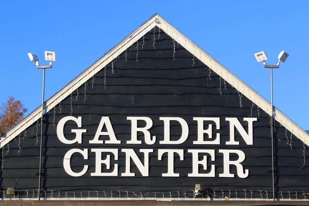 a black and white sign that says garden center