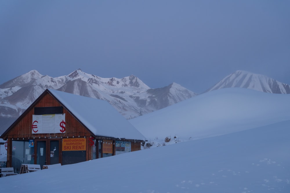 a building in the middle of a snowy mountain range