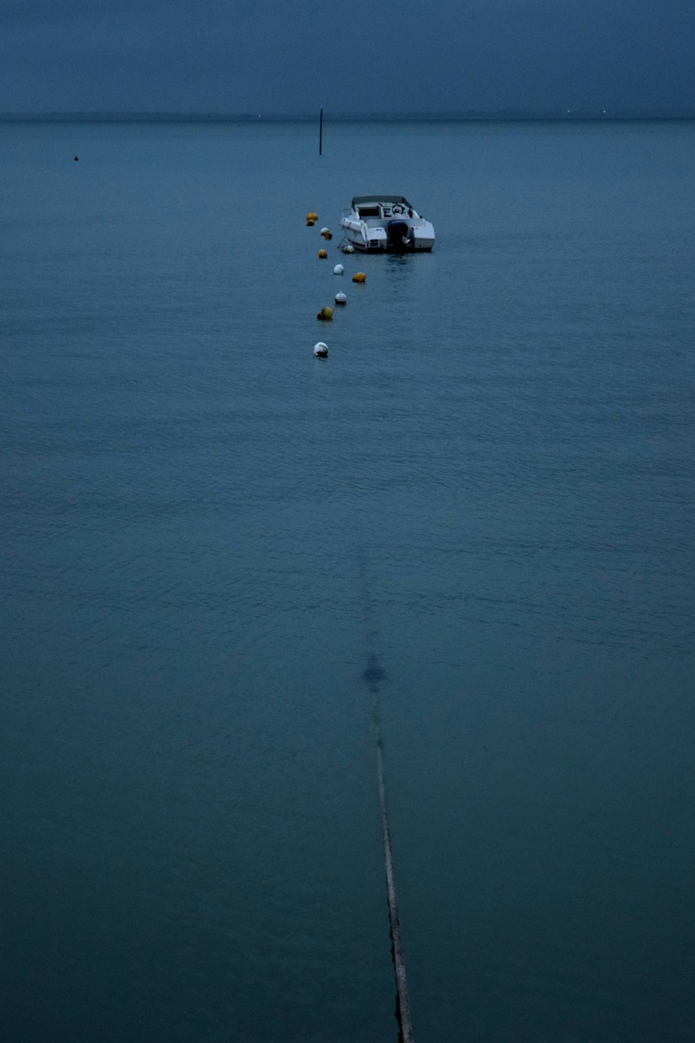 a boat floating on top of a large body of water