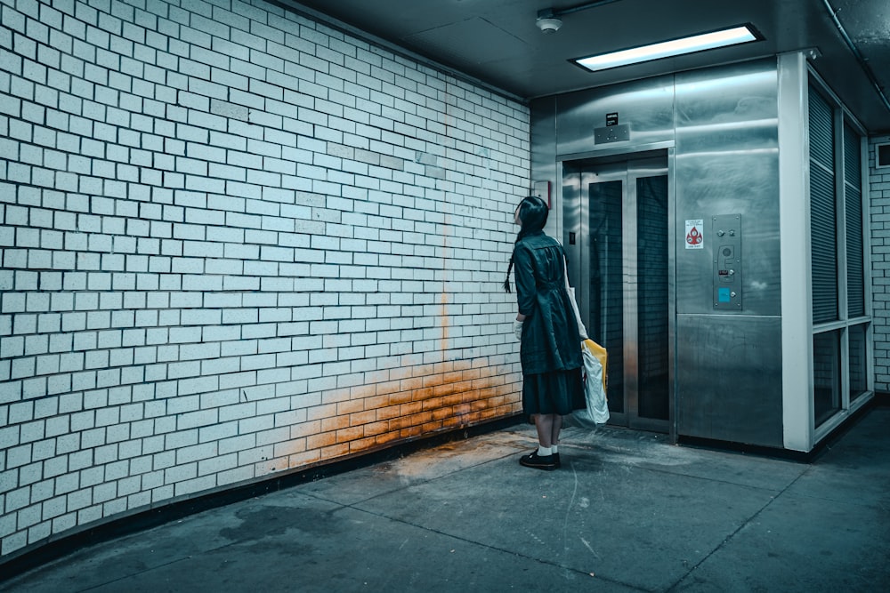 a person standing in front of an elevator