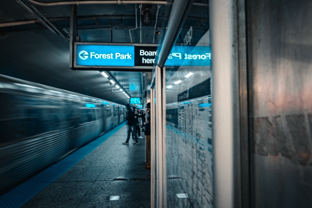 a subway station with a sign that says forest park metro