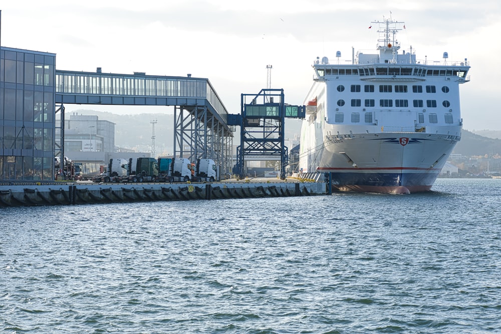 a large boat is docked at a dock