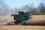 Farm machinery working through the soybean fields during harvest.
