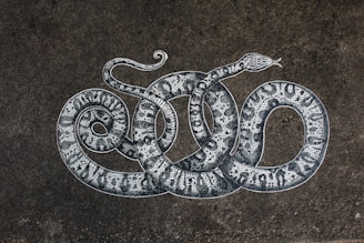 Multiple snakes weaving through a maze-like pattern on the page background.