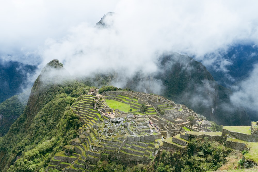 a view of a mountain with a few buildings on top of it