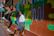 Two startup founders chatting enthusiastically beside a mural inspired by Los Angeles culture.