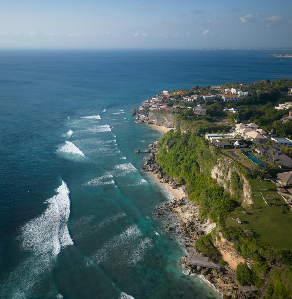 an aerial view of the ocean and a beach