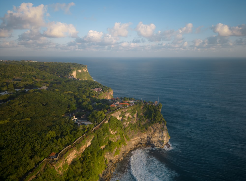 an aerial view of a cliff overlooking the ocean