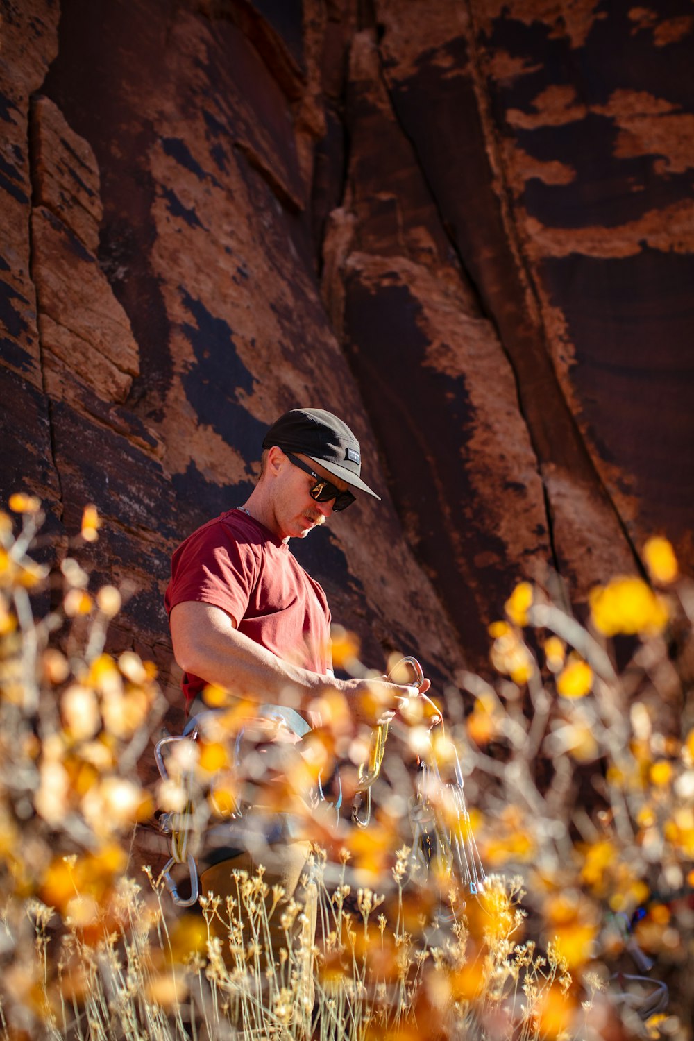 a man standing in a field of yellow flowers