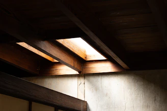Custom wooden ceiling beams adding rustic charm to a spacious room