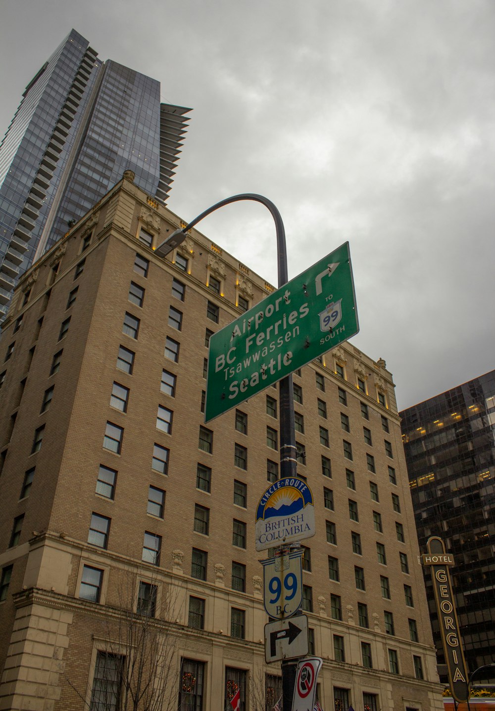 a street sign in front of a tall building