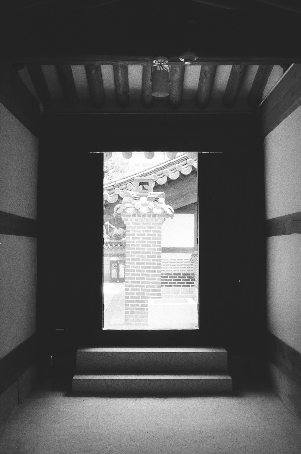 a black and white photo of a doorway