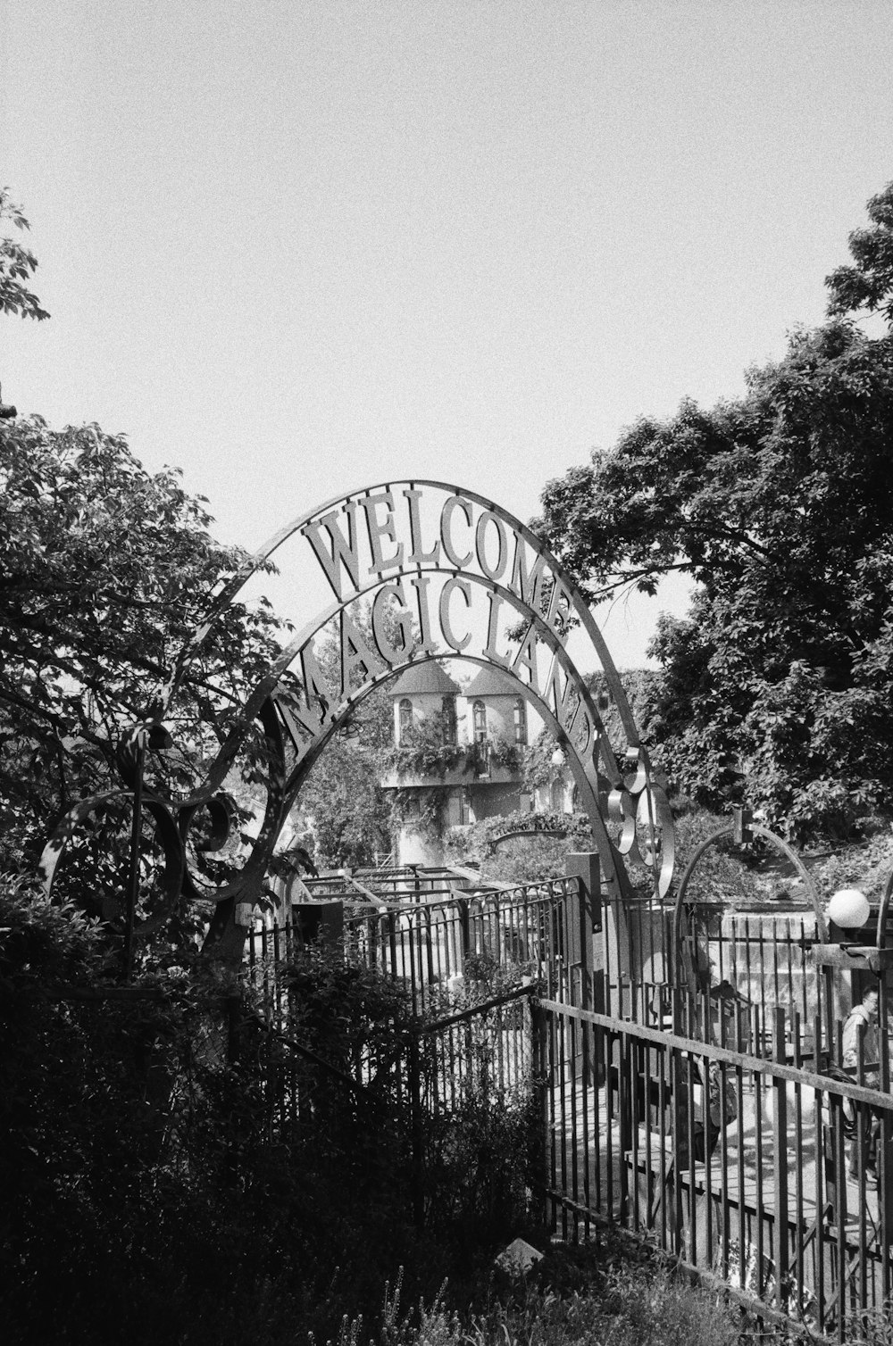 a black and white photo of a welcome sign