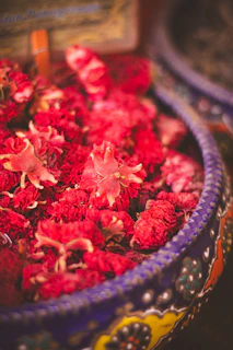 Hand-painted ceramic bowl filled with fresh flowers, showcasing craftsmanship