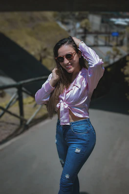 Casual street style outfit worn by a young woman smiling on a sunny day.