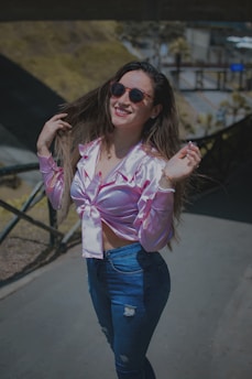 A stylish woman wearing a casual outfit outdoors.