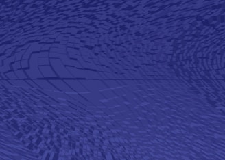 A digital abstract background featuring a dynamic wave-like pattern composed of small cubes and rectangles in varying shades of blue. The design creates a sense of movement and depth, with the rectangles becoming more distorted towards the edges.