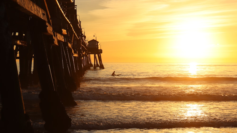 a person riding a surf board on a body of water