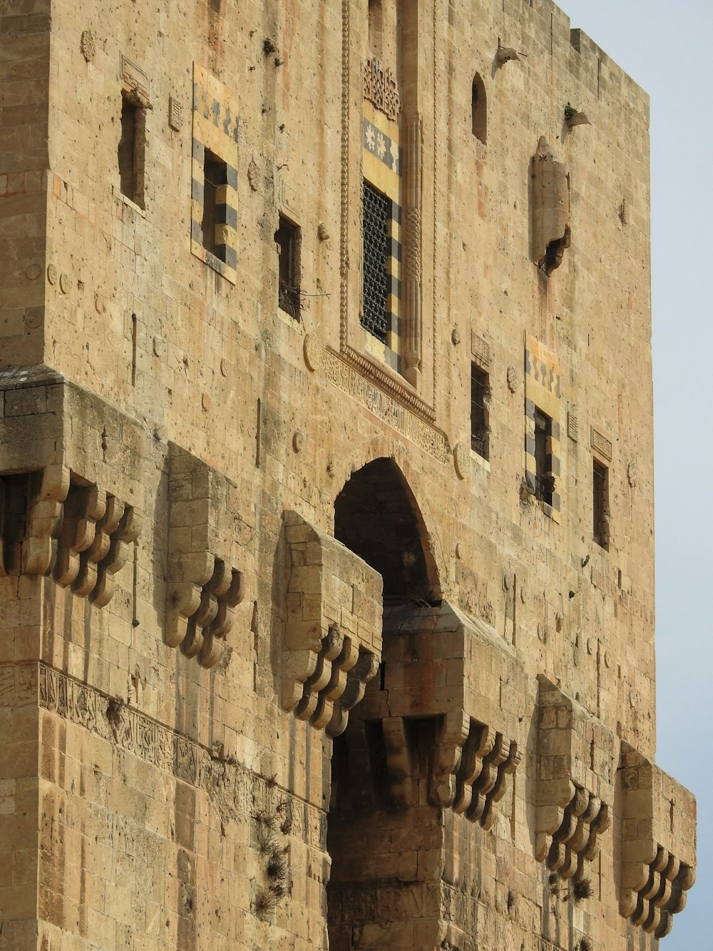 a very tall building with a clock on it's side