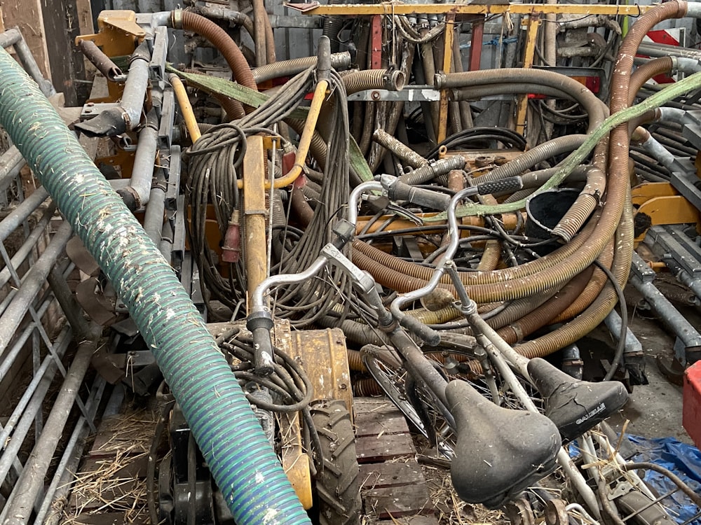 a pile of different types of wires and hoses
