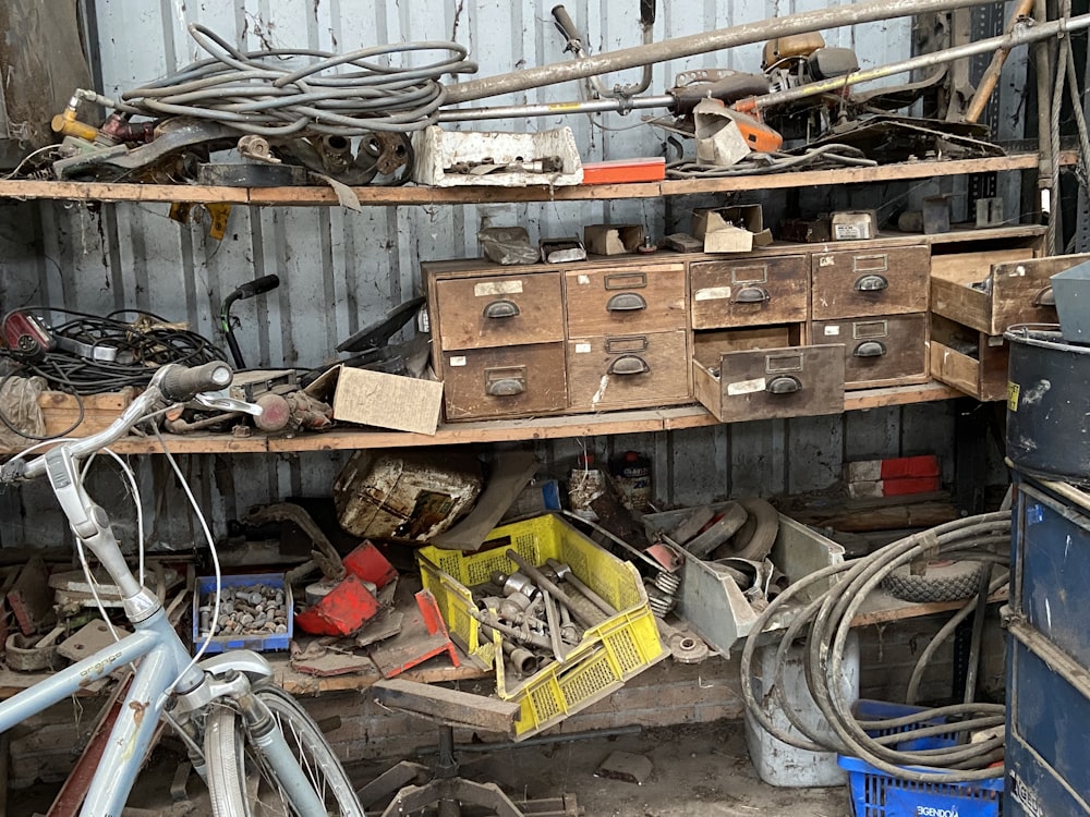 a garage filled with lots of clutter and tools