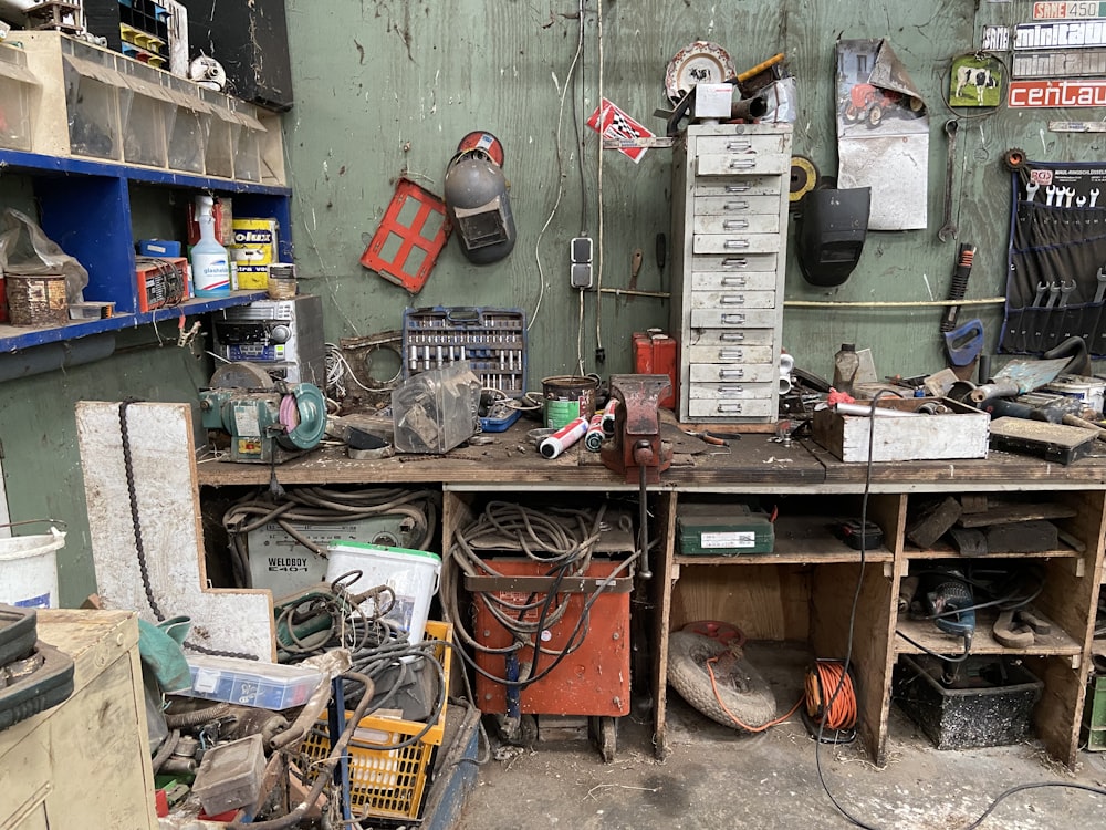 a workbench filled with lots of clutter and tools
