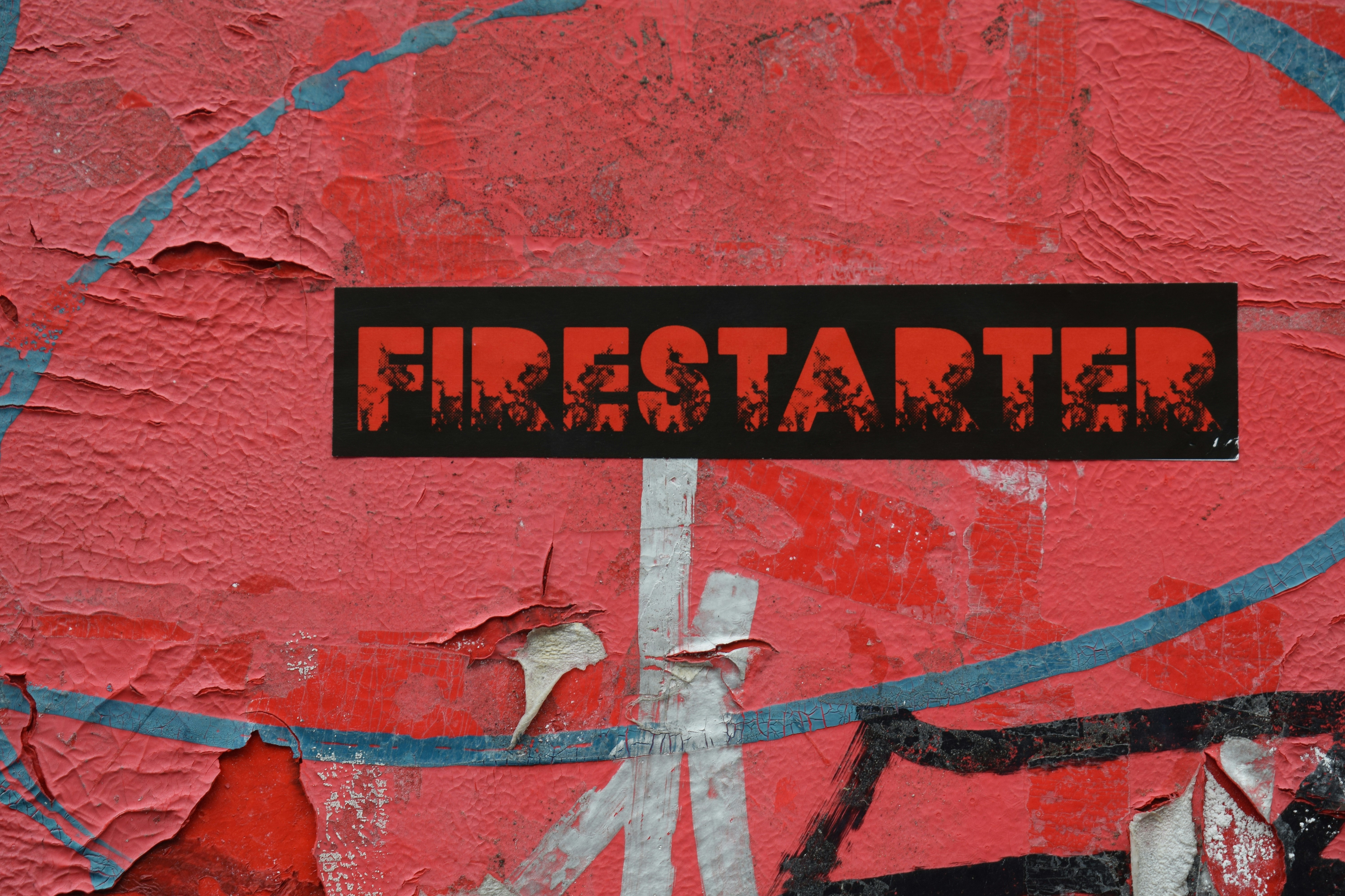 Close-up of fire starter packaging featuring black, red, orange, and white colors.