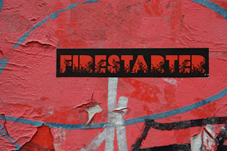 Close-up of fire starter packaging featuring black, red, orange, and white colors.