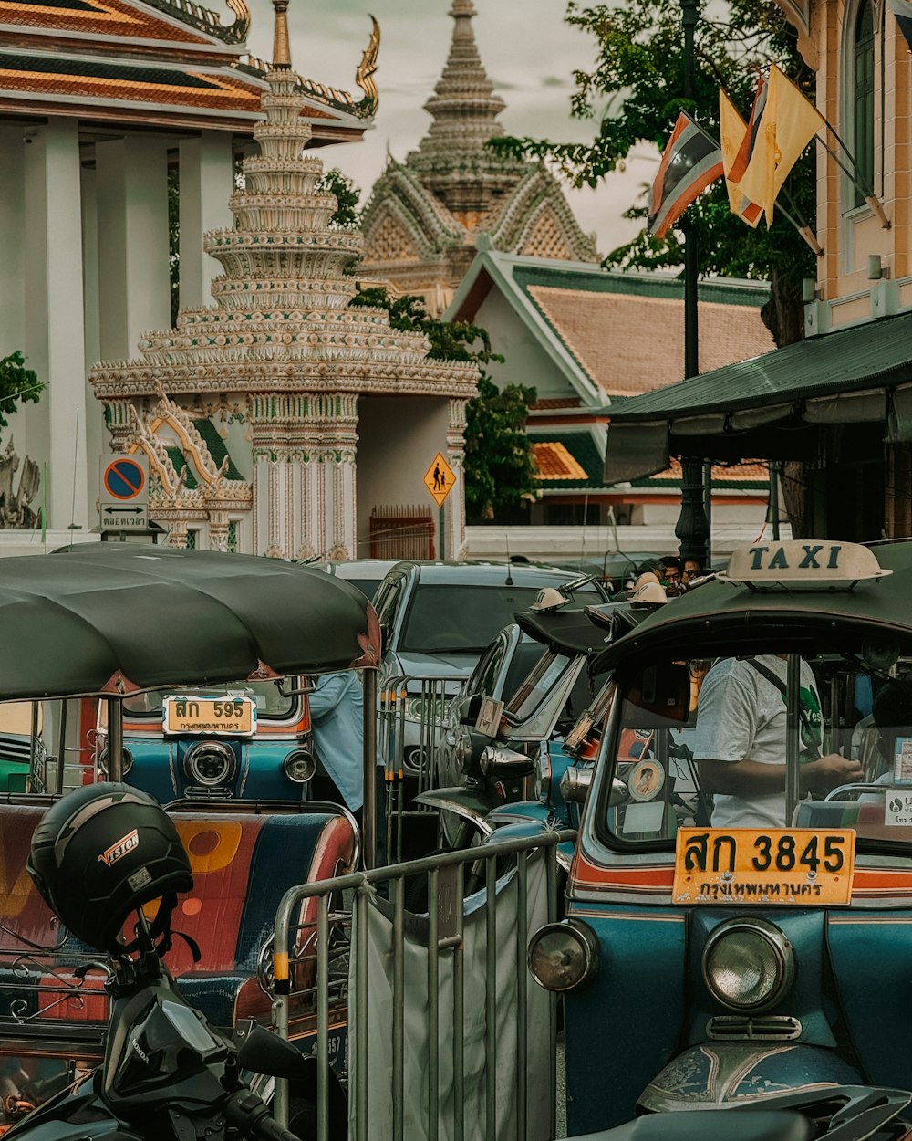 a group of cars parked next to each other on a street