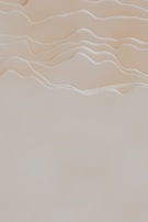 A serene beige and white color palette creating a calm, luxurious atmosphere.