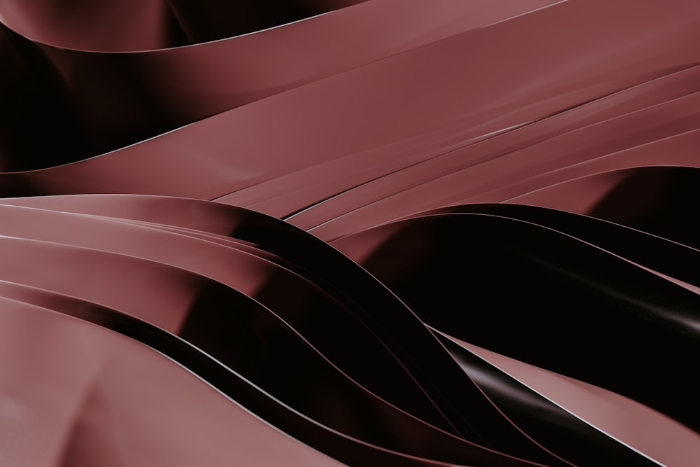 a red and black abstract background with wavy lines