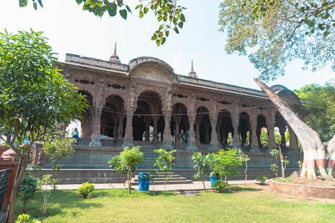 a large building with a tree in front of it