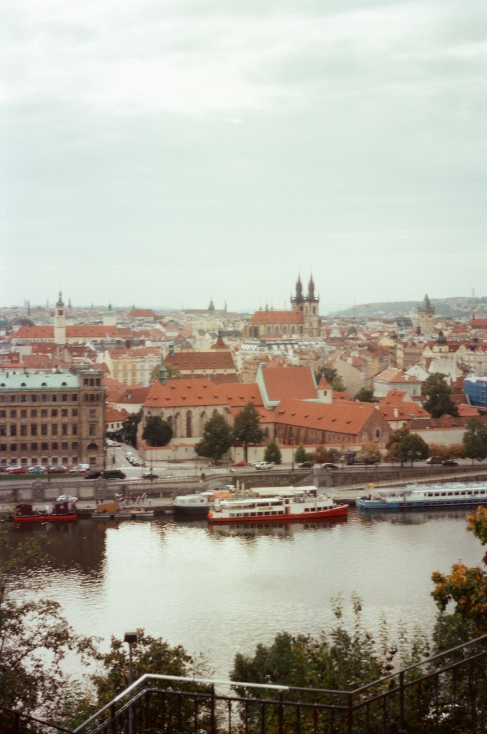 a view of a river and a city from a hill