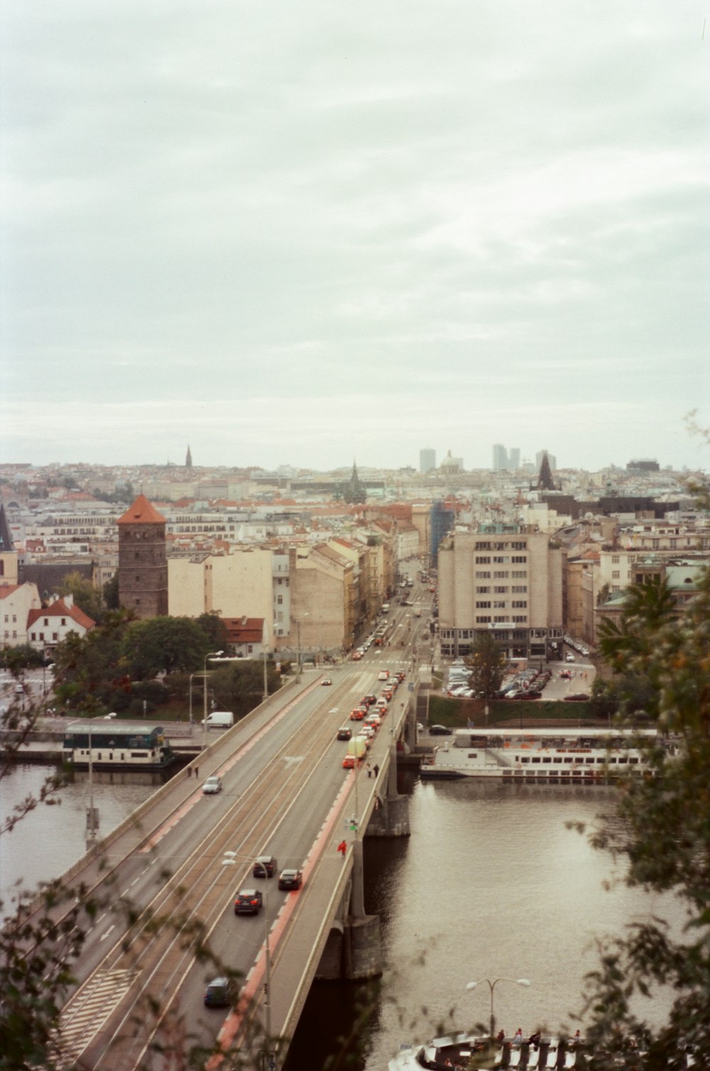 a view of a city with a bridge over a river