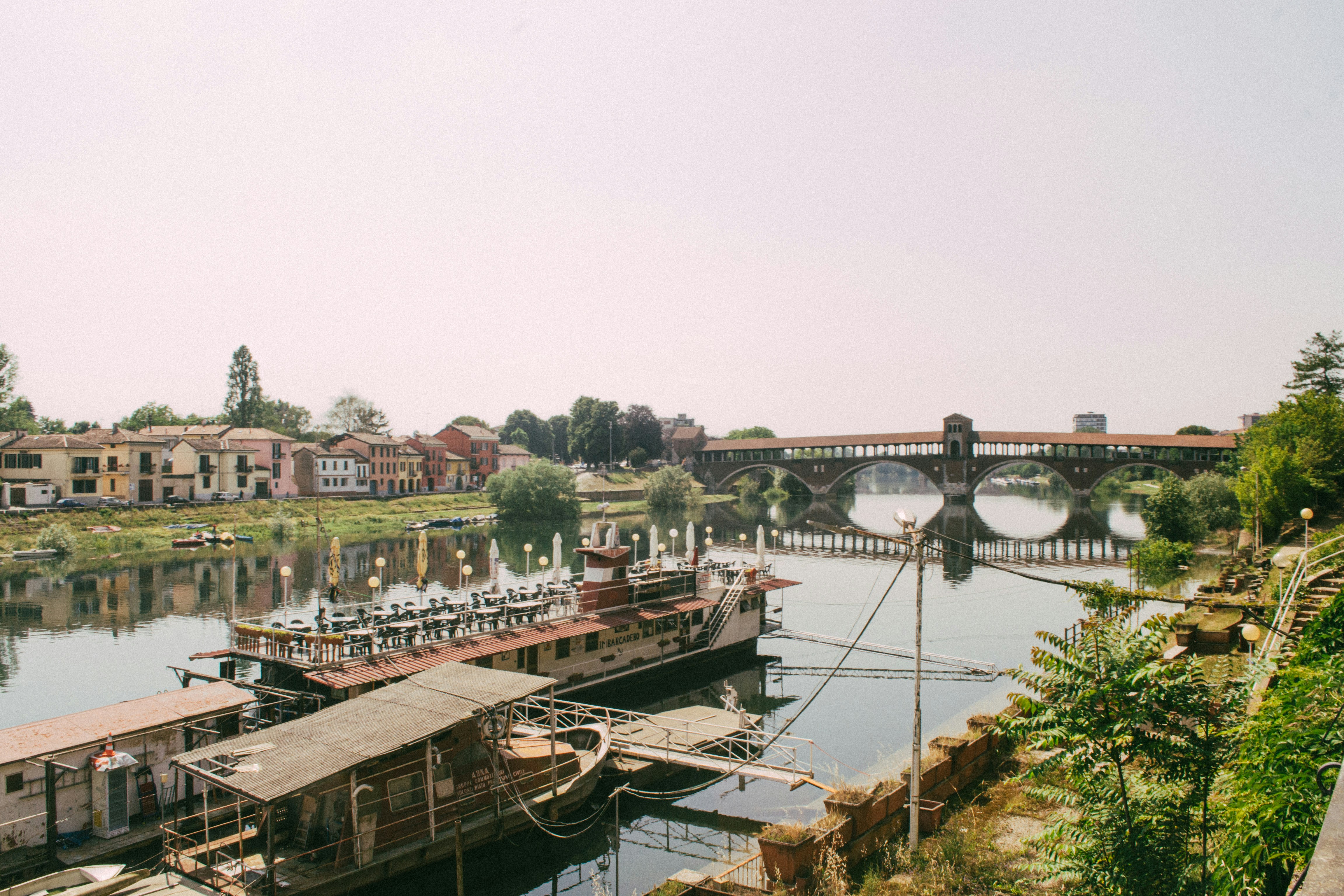 a river with a bridge in the background