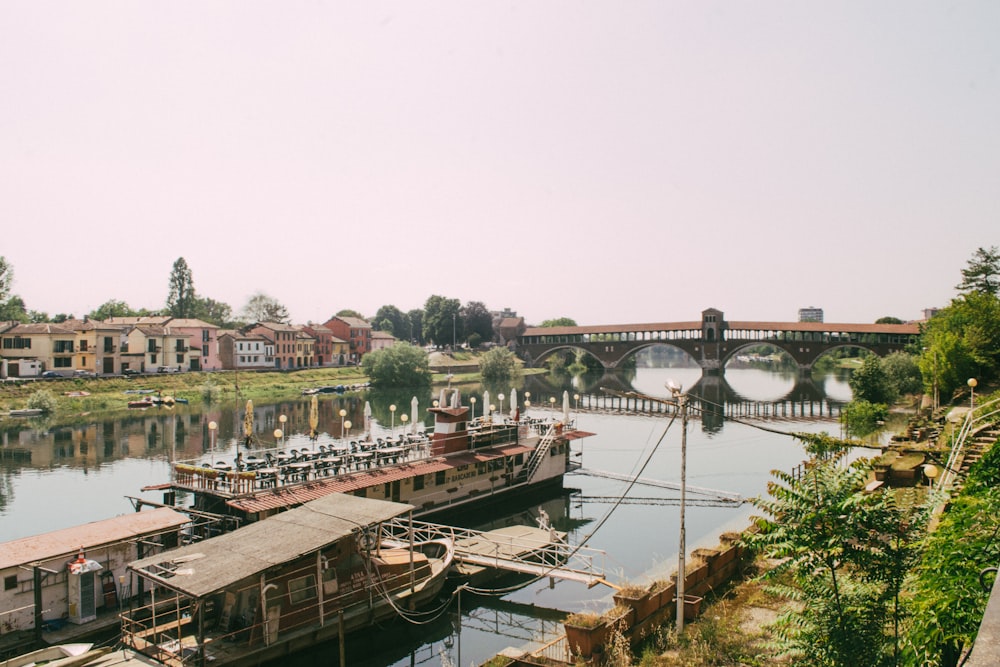 a river with a bridge in the background