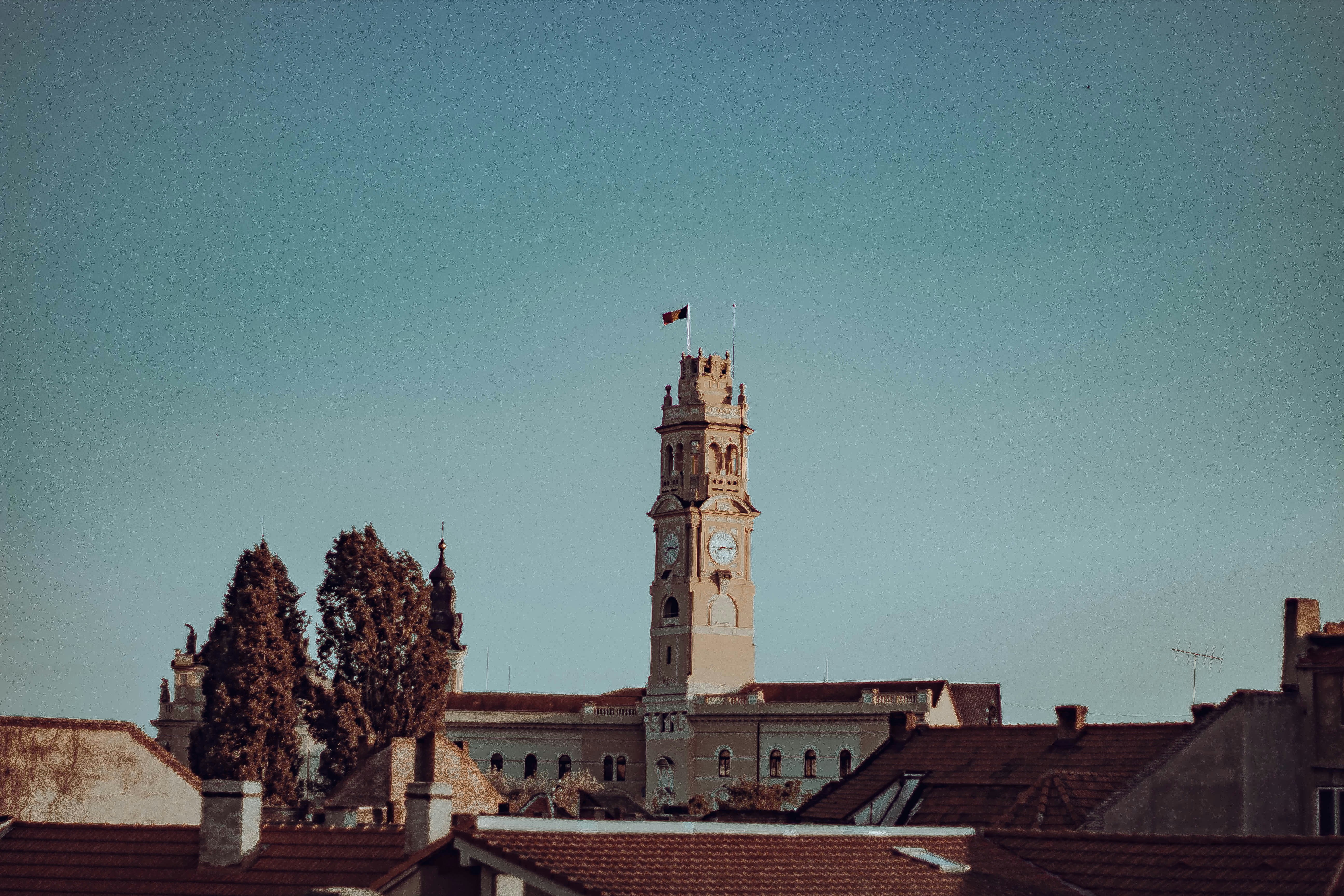 a tall clock tower towering over a city