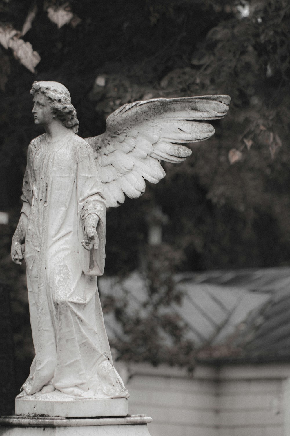 a statue of an angel with outstretched wings