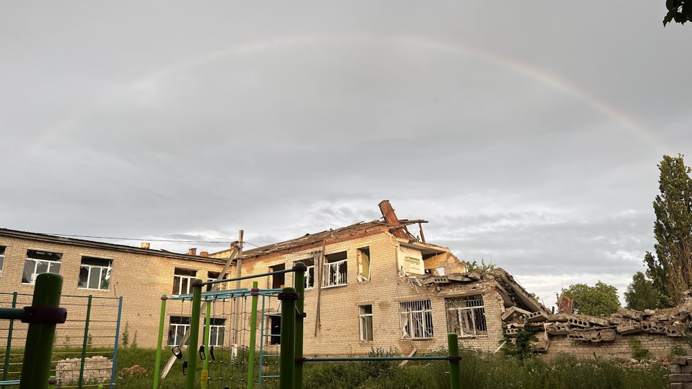 a house that has a rainbow in the sky