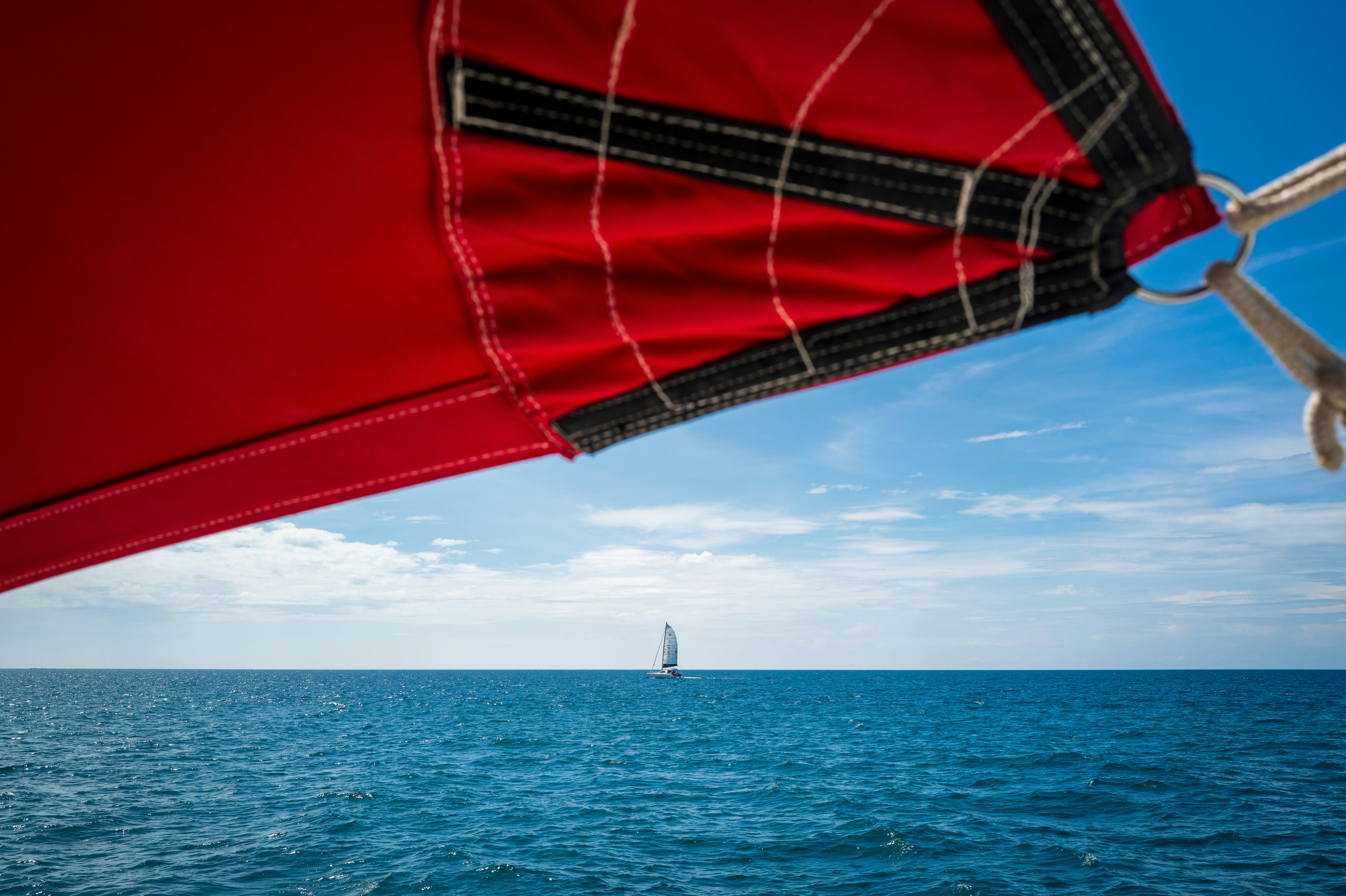 a sailboat sailing in the open ocean