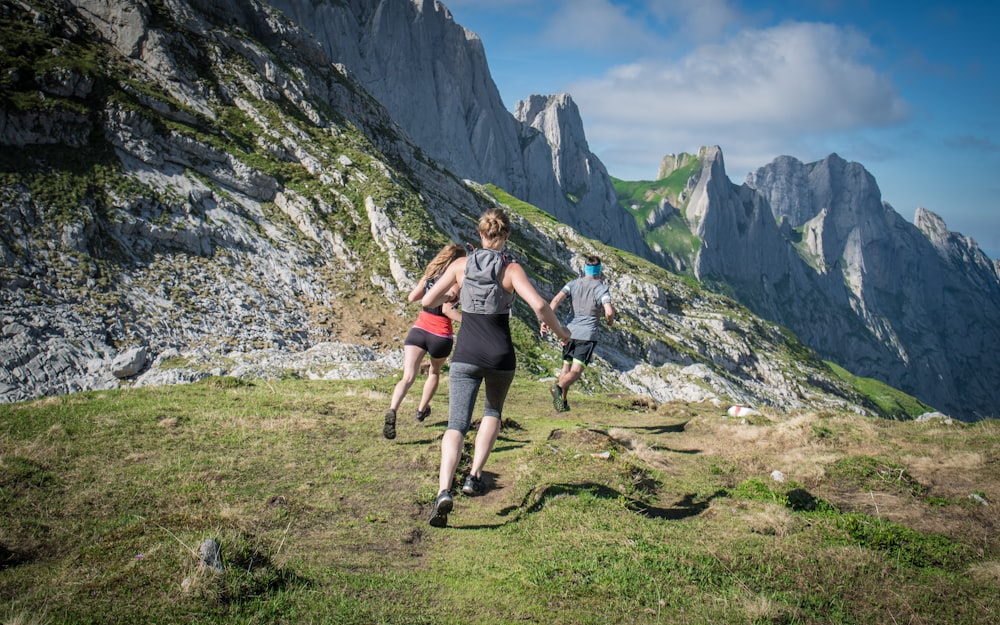 a group of people hiking up a mountain