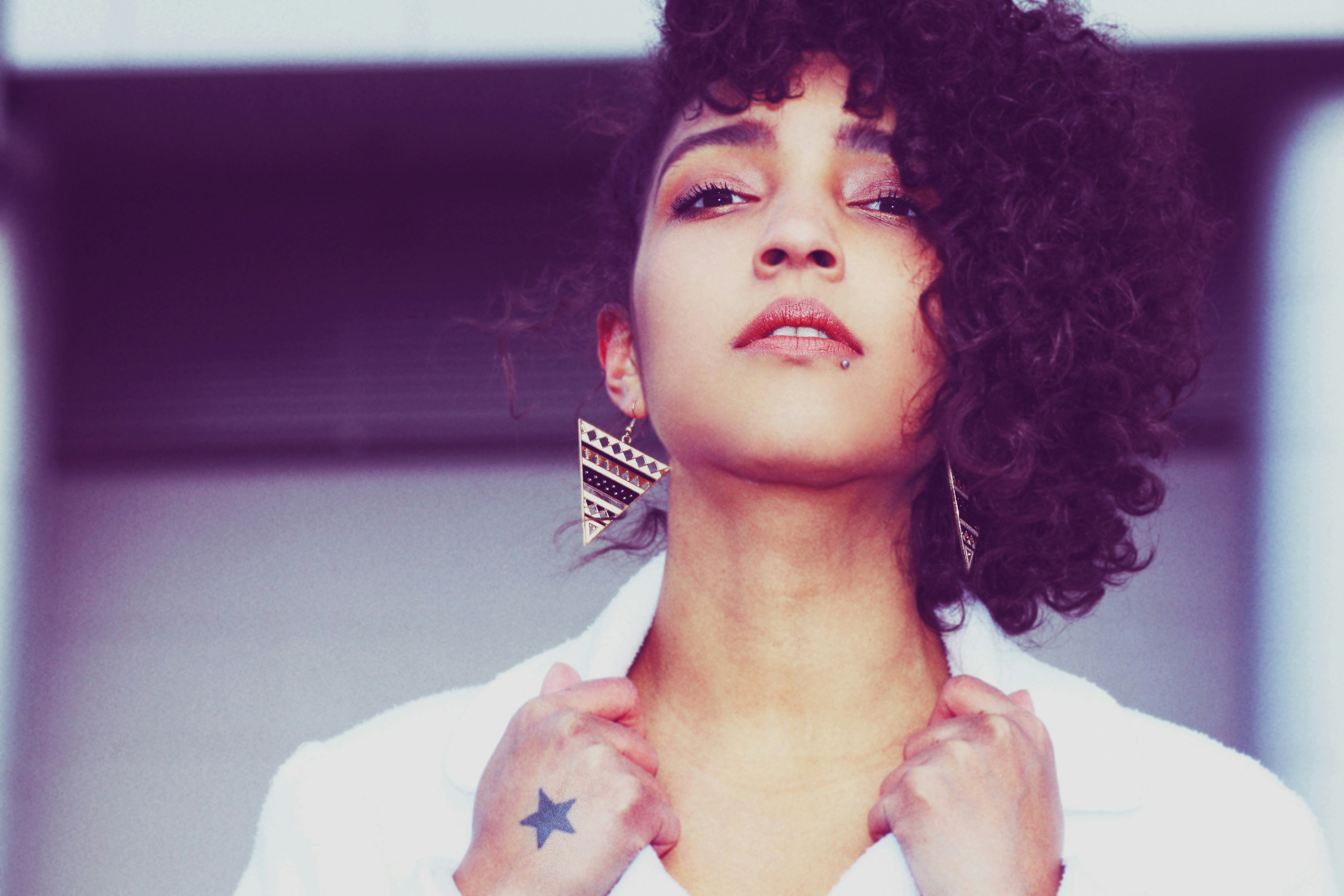 a close up of a person wearing a white shirt