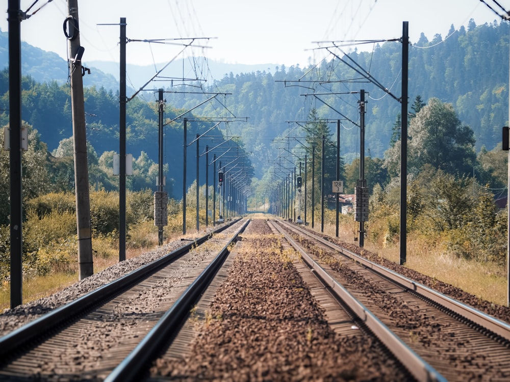 a train track running through a rural countryside