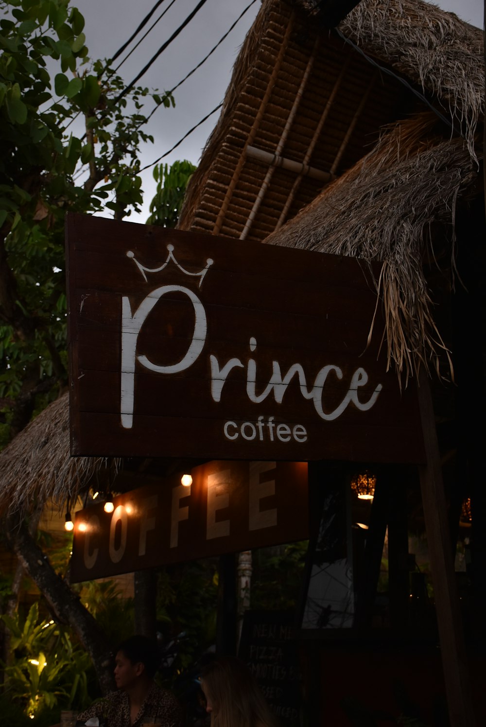 a sign that says prince coffee on it