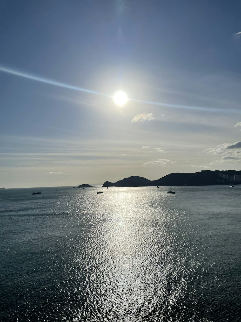 a body of water with boats in the distance